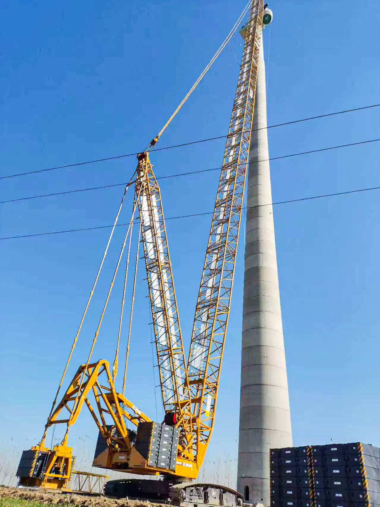 160米高空精准“搭积木”：三亿体育XLC15000M分体吊装6.25兆瓦风机全纪录